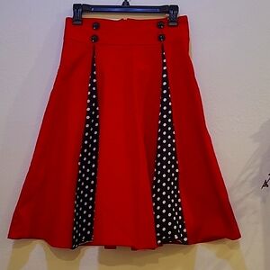 Unknown,  M, Red skirt with 2 black pleats with white polka dots.